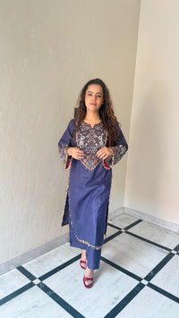 Thread embroidery work with coin tassels