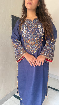 Thread embroidery work with coin tassels