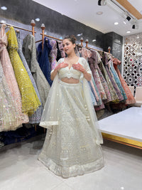 Enchanting White Net Lehenga with Mirror Magic